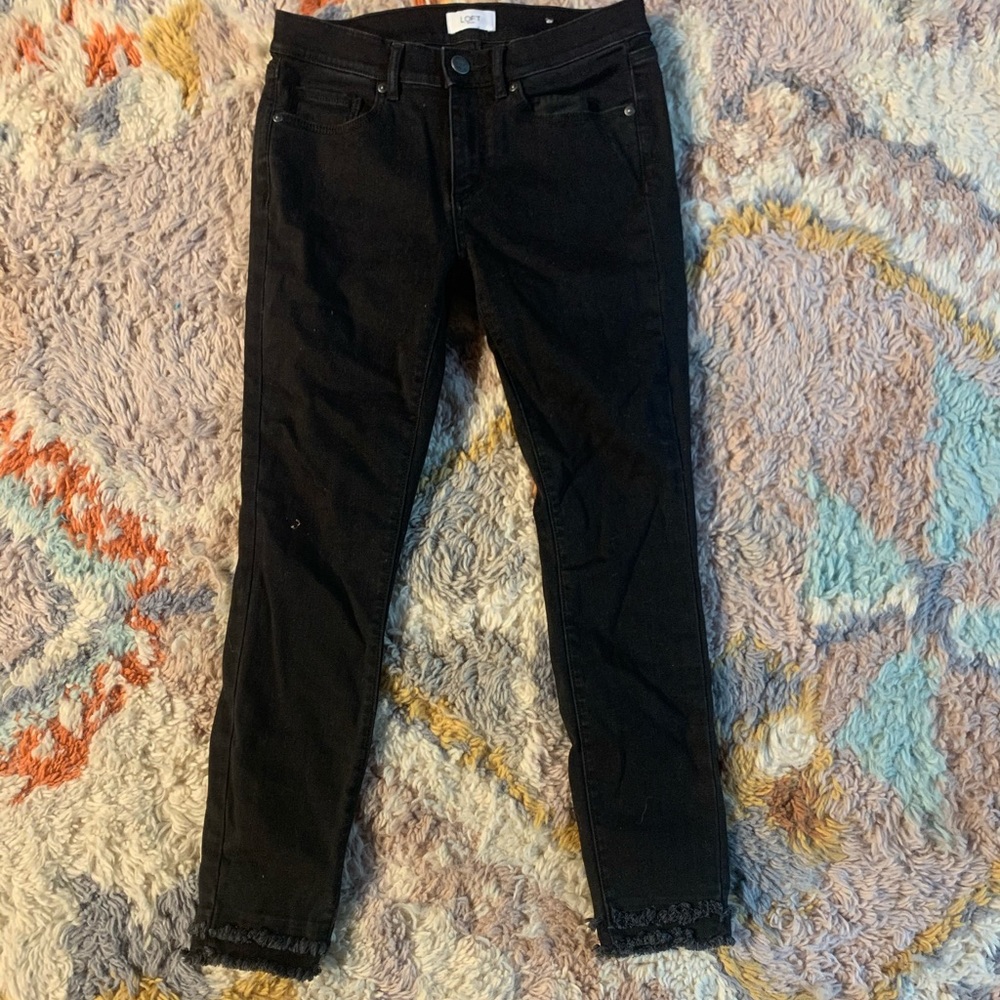 Frayed black jeans